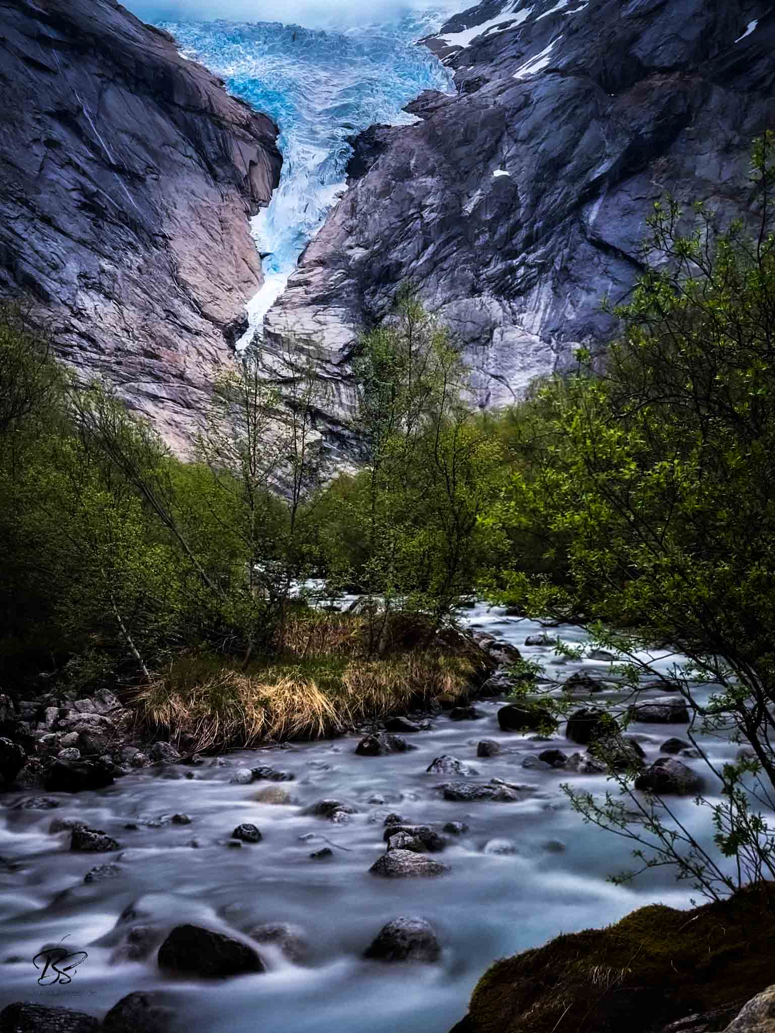 Briksdal Glacier with waterfall and valley