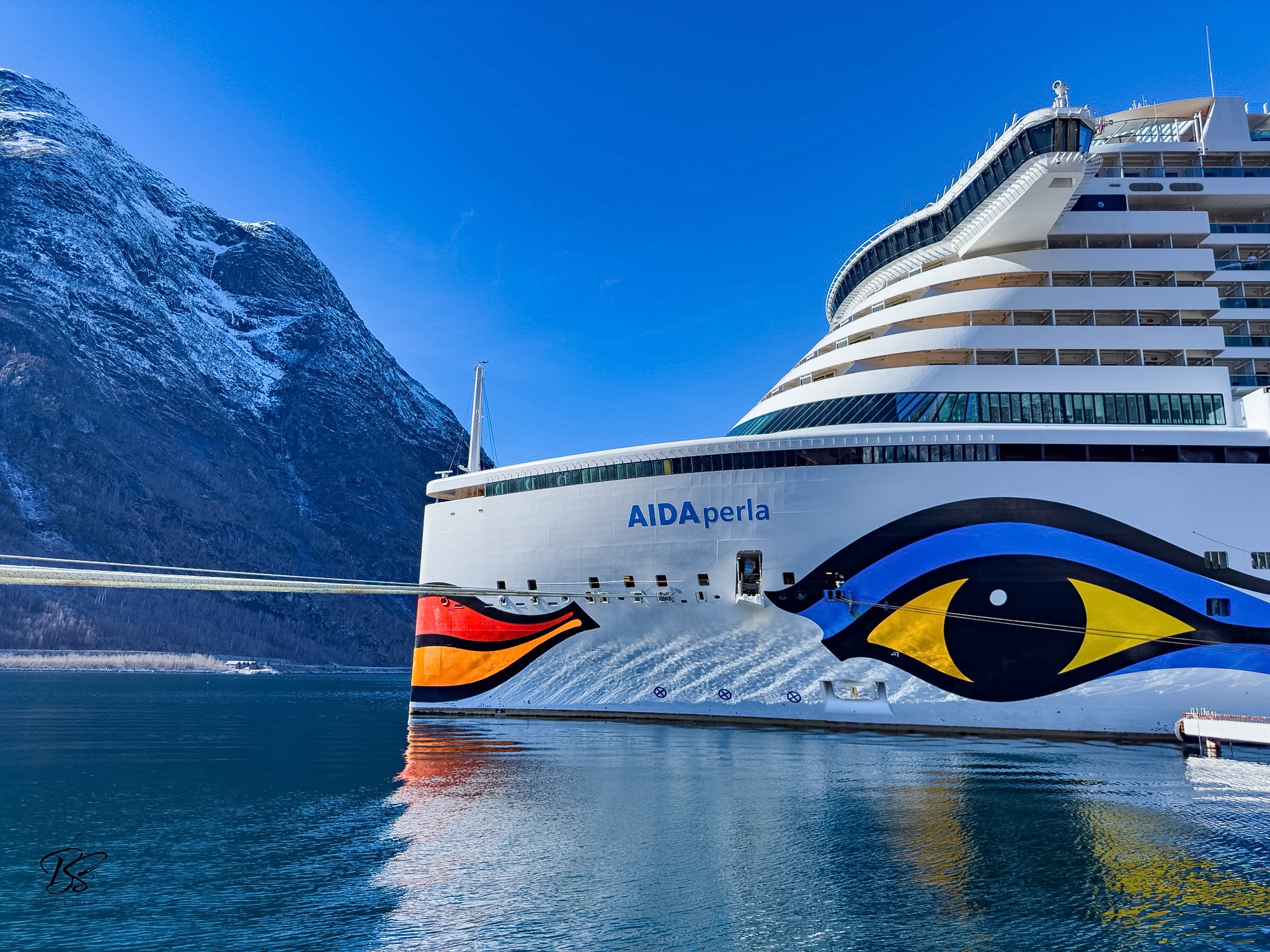 Eidfjord fjord at blue hour as cruise ship prepares to depart at dusk